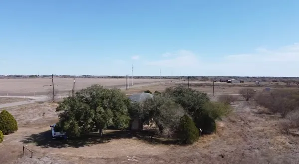 a view of a lake in middle of the forest