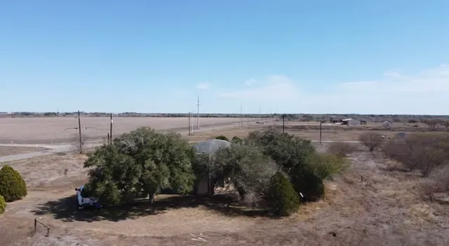 a view of a lake in middle of the forest
