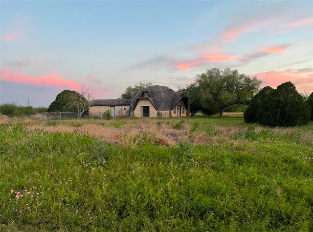a view of a lake with sunset