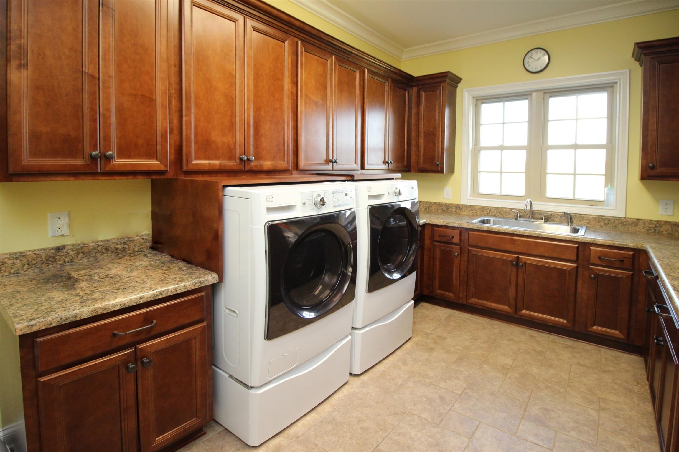 4385 Goodman Road Adams, TN 37010 - Photo 22 of 30 Laundry Room with Sink and Tons of Storage