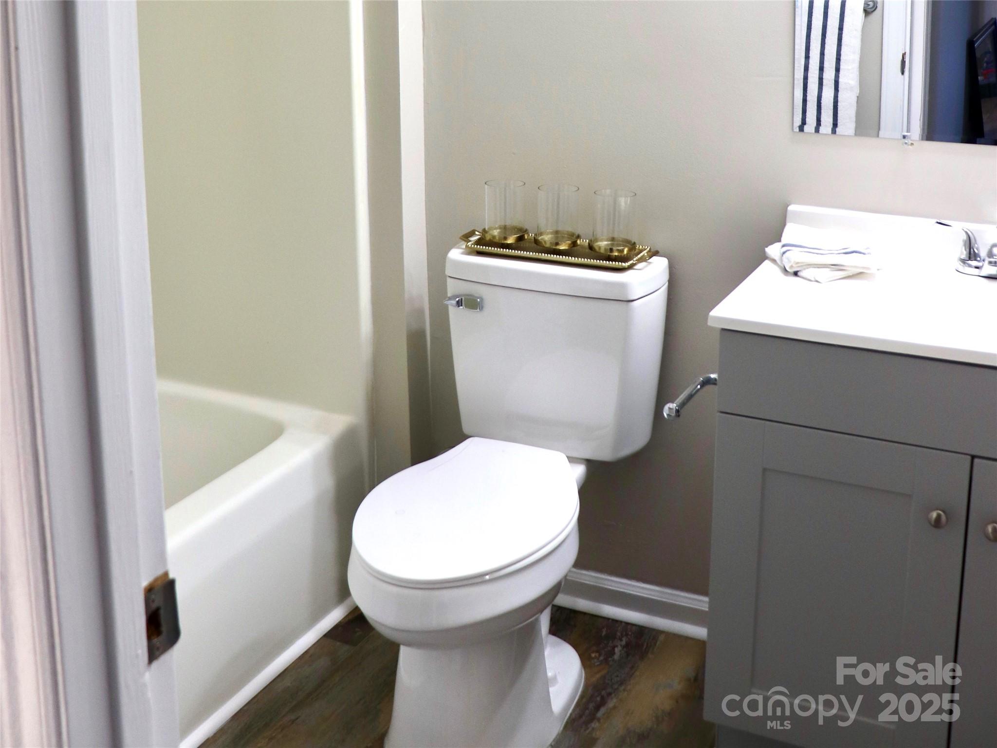 802 Marshall Street Cheraw, SC 29520 - Photo 12 of 16 a white toilet sitting next to a bathroom sink