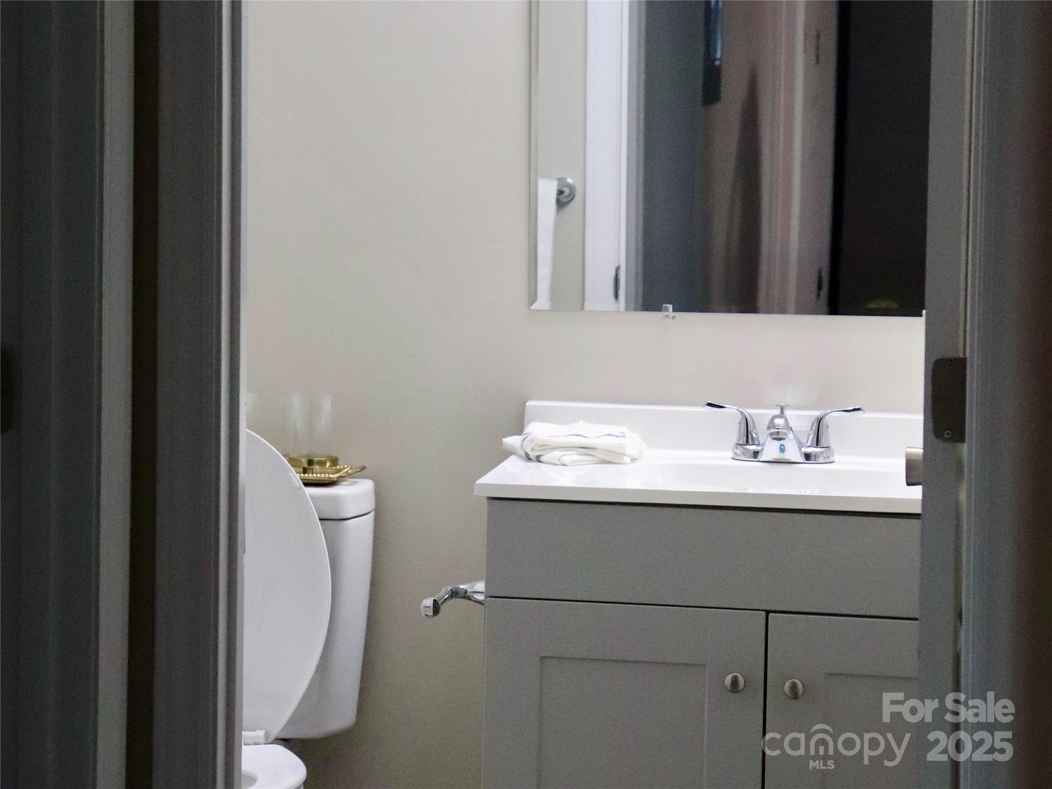 802 Marshall Street Cheraw, SC 29520 - Photo 13 of 16 a bathroom with a sink and mirror