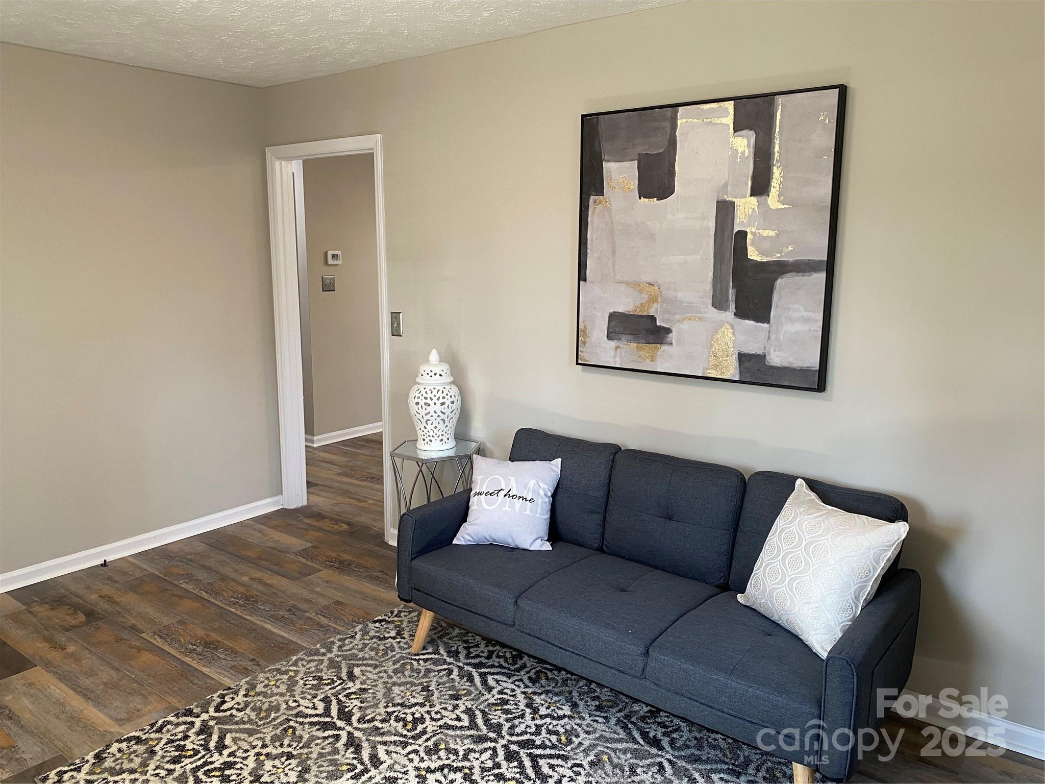 802 Marshall Street Cheraw, SC 29520 - Photo 3 of 16 a living room with a couch