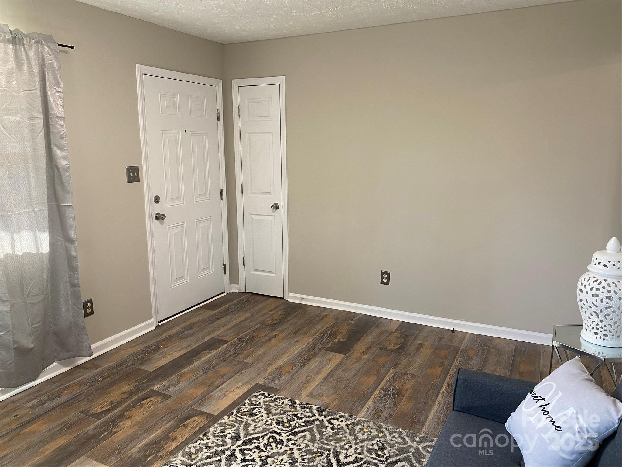 802 Marshall Street Cheraw, SC 29520 - Photo 4 of 16 a view of room with window and wooden floor