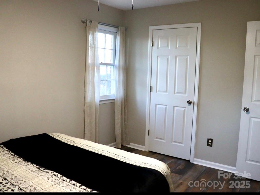 802 Marshall Street Cheraw, SC 29520 - Photo 9 of 16 a bedroom with a bed and a window
