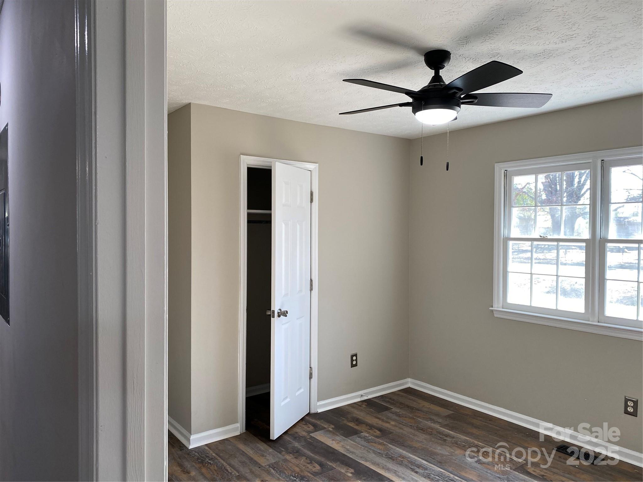 802 Marshall Street Cheraw, SC 29520 - Photo 10 of 16 a view of a big room with wooden floor closet and windows
