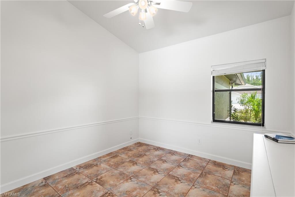 1348 Monarch Circle Naples, FL 34116 - Photo 22 of 33 an empty room with windows