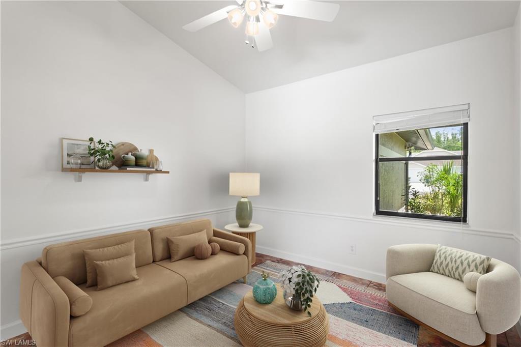 1348 Monarch Circle Naples, FL 34116 - Photo 23 of 33 a living room with furniture and a window