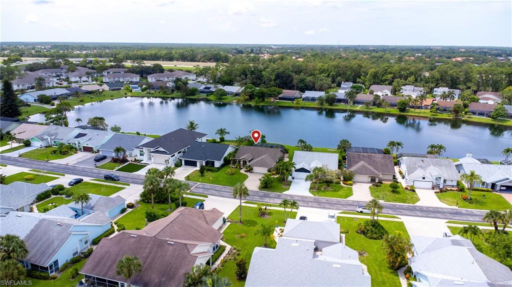 1348 Monarch Circle Naples, FL 34116 - Photo 25 of 33 an aerial view of a houses with an outdoor space and seating area