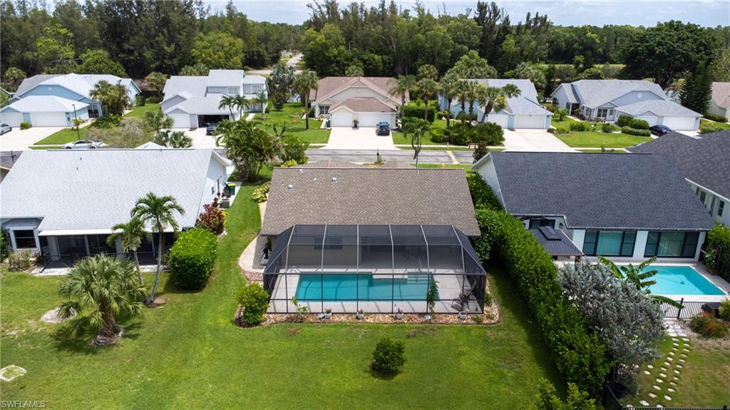 1348 Monarch Circle Naples, FL 34116 - Photo 26 of 33 a aerial view of a house with a yard and potted plants
