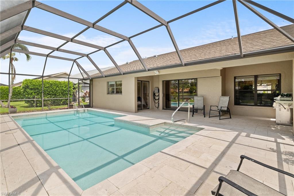 1348 Monarch Circle Naples, FL 34116 - Photo 27 of 33 a view of a porch with chairs and backyard
