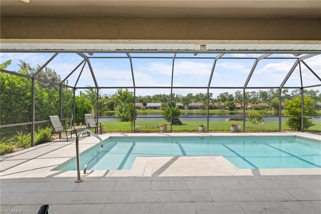 1348 Monarch Circle Naples, FL 34116 - Photo 28 of 33 a view of swimming pool with seating space and stairs