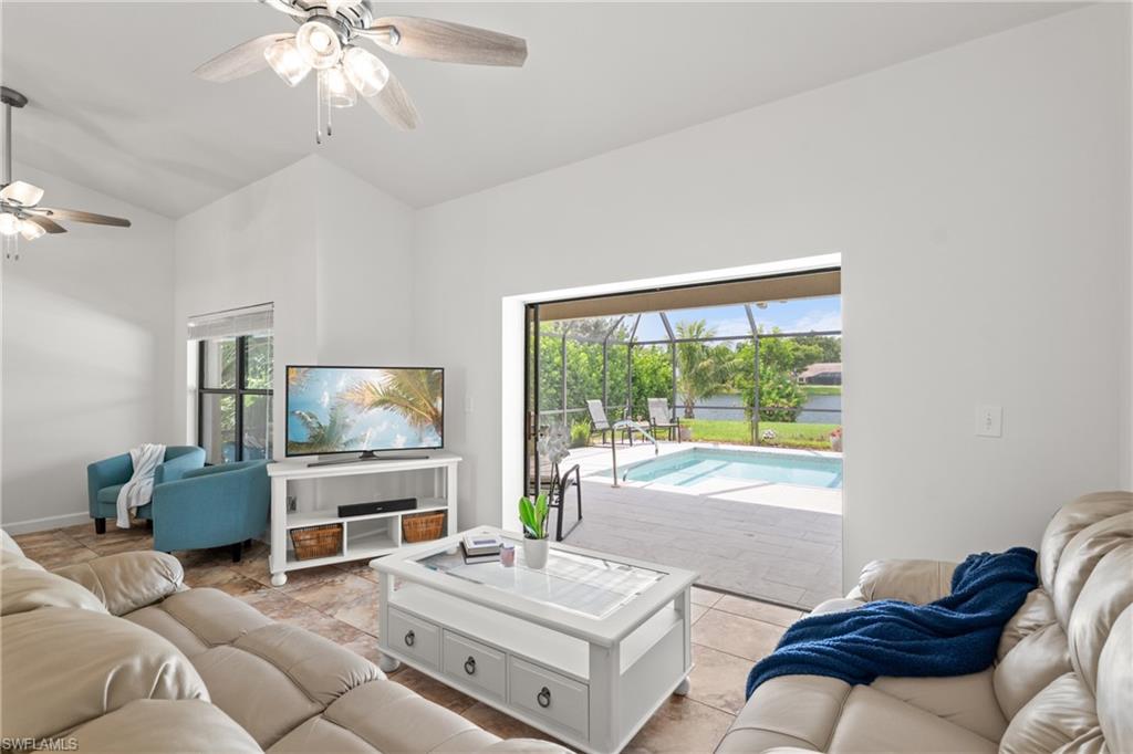 1348 Monarch Circle Naples, FL 34116 - Photo 3 of 33 a living room with furniture and a flat screen tv