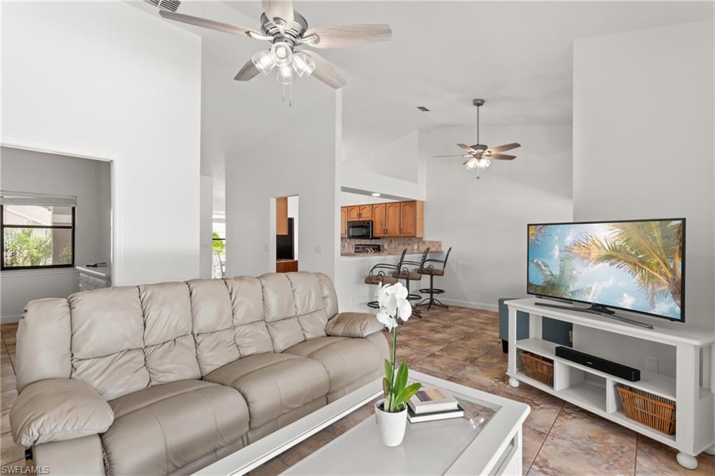 1348 Monarch Circle Naples, FL 34116 - Photo 5 of 33 a living room with furniture and a flat screen tv