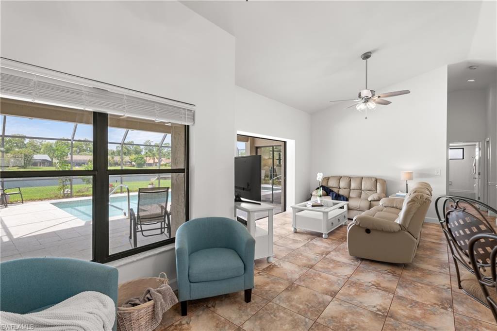 1348 Monarch Circle Naples, FL 34116 - Photo 7 of 33 a living room with furniture and a large window