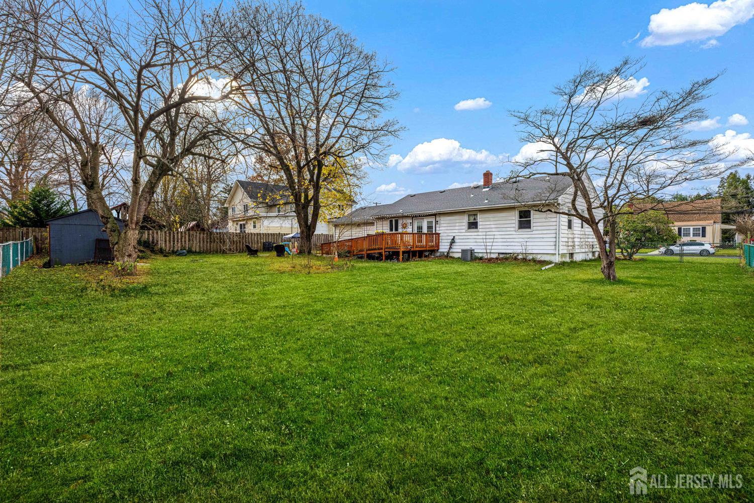 149 Springdale Avenue Hamilton, NJ 08620 - Photo 11 of 43 a view of a house with a big yard with large tree and plants