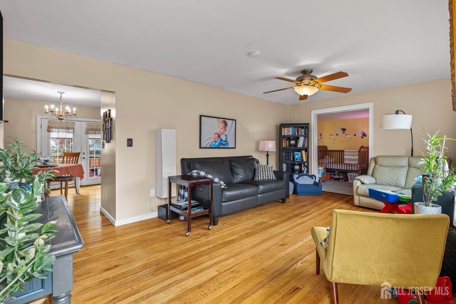 149 Springdale Avenue Hamilton, NJ 08620 - Photo 24 of 43 a living room with furniture and a wooden floor