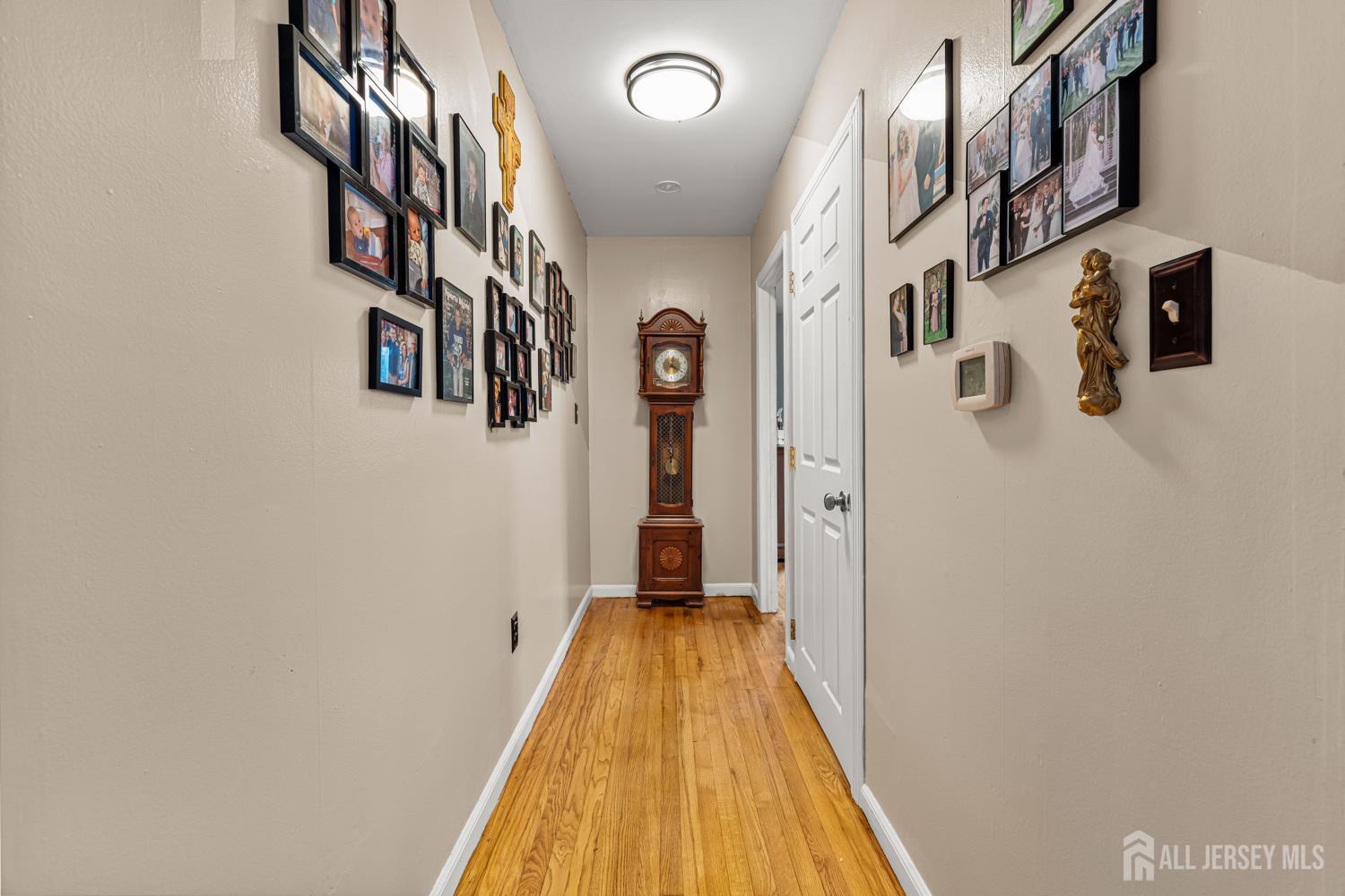149 Springdale Avenue Hamilton, NJ 08620 - Photo 26 of 43 a view of a hallway with wooden floor