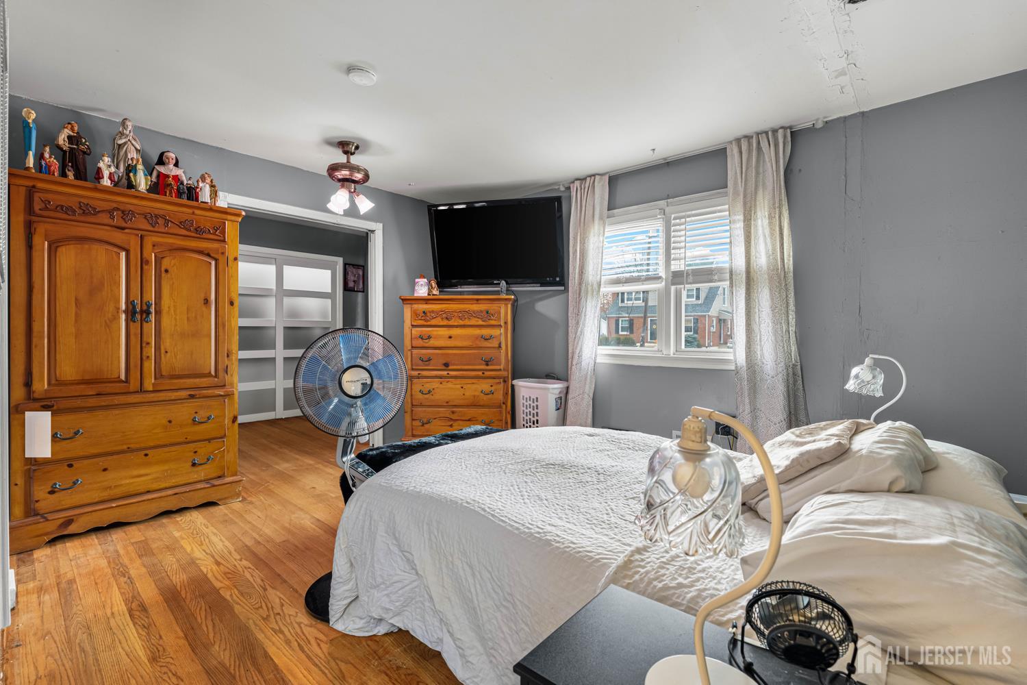 149 Springdale Avenue Hamilton, NJ 08620 - Photo 29 of 43 a bedroom with a bed and wooden floor