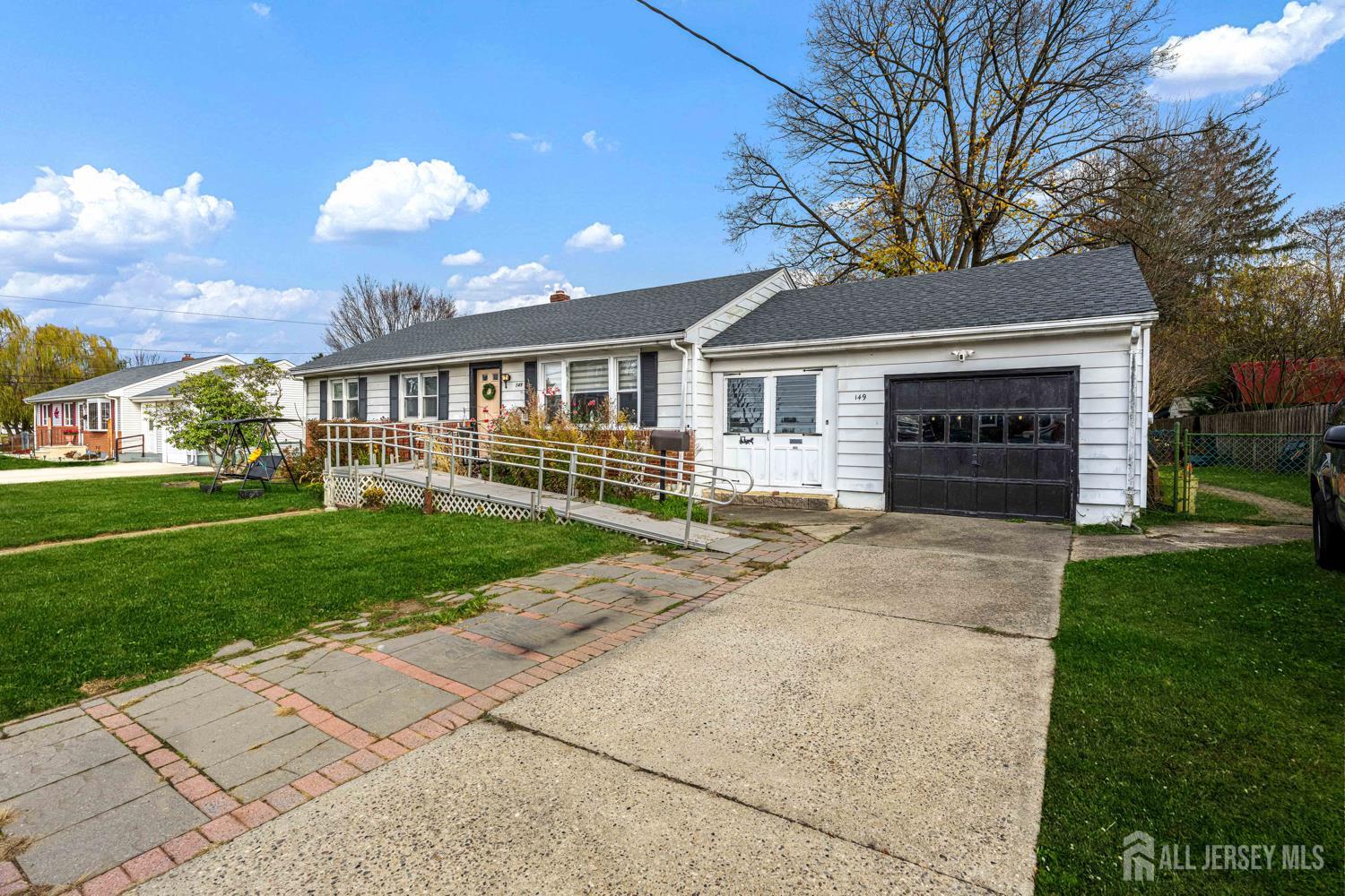 149 Springdale Avenue Hamilton, NJ 08620 - Photo 3 of 43 front view of a house with a yard