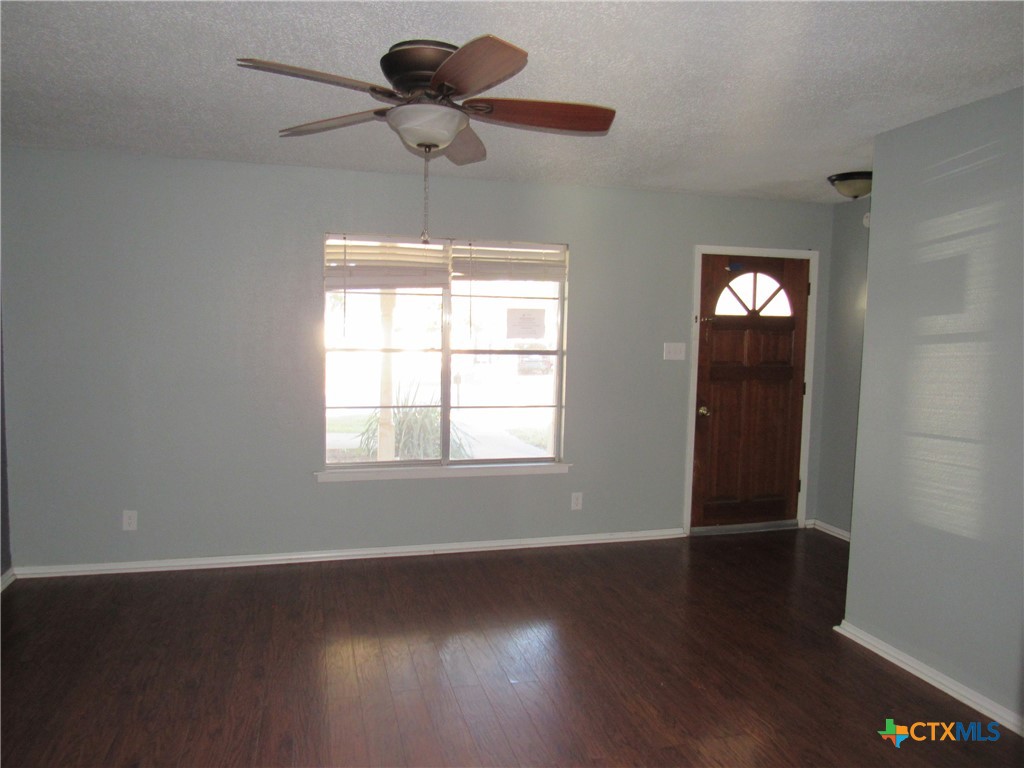1325 Paseo Del Cobre Temple, TX 76502 - Photo 2 of 15 a view of an empty room with wooden floor and a window