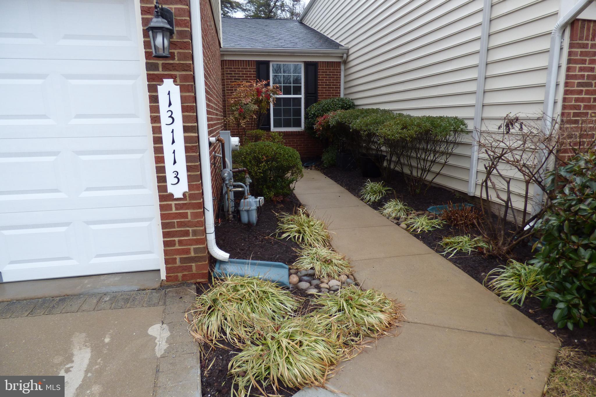 13113 Winding Trail Road Laurel, MD 20707 - Photo 3 of 47 a front view of a house with a yard