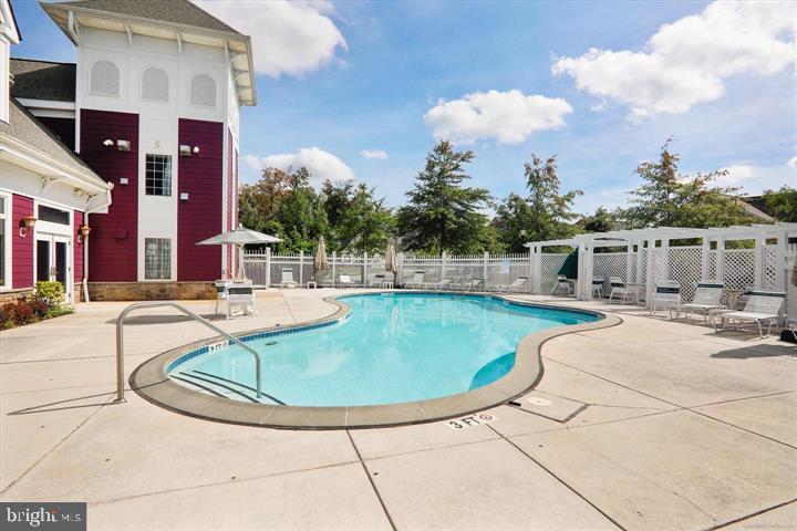 13113 Winding Trail Road Laurel, MD 20707 - Photo 38 of 47 a view of a swimming pool with outdoor seating
