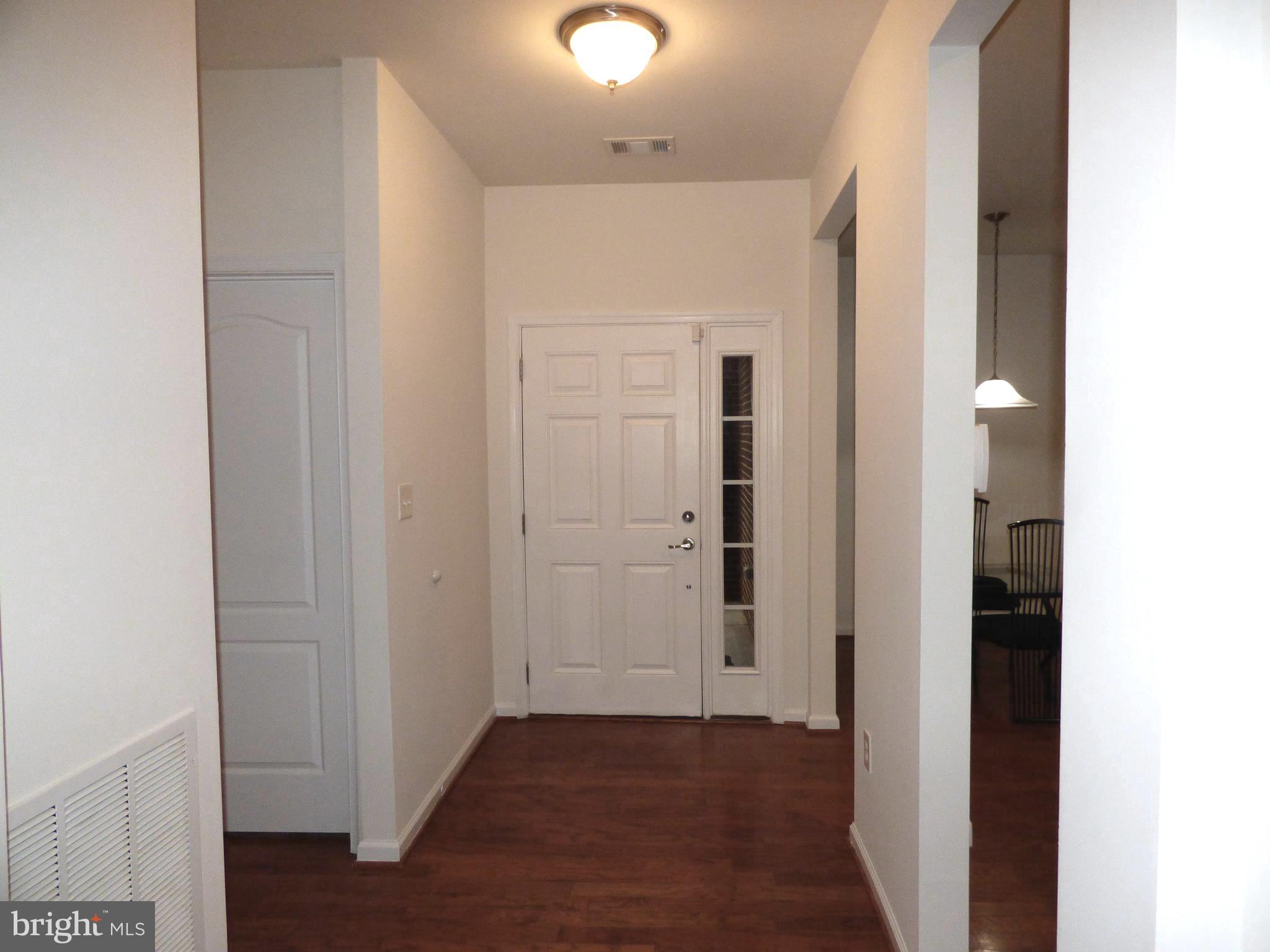 13113 Winding Trail Road Laurel, MD 20707 - Photo 6 of 47 a view of a hallway with wooden floor