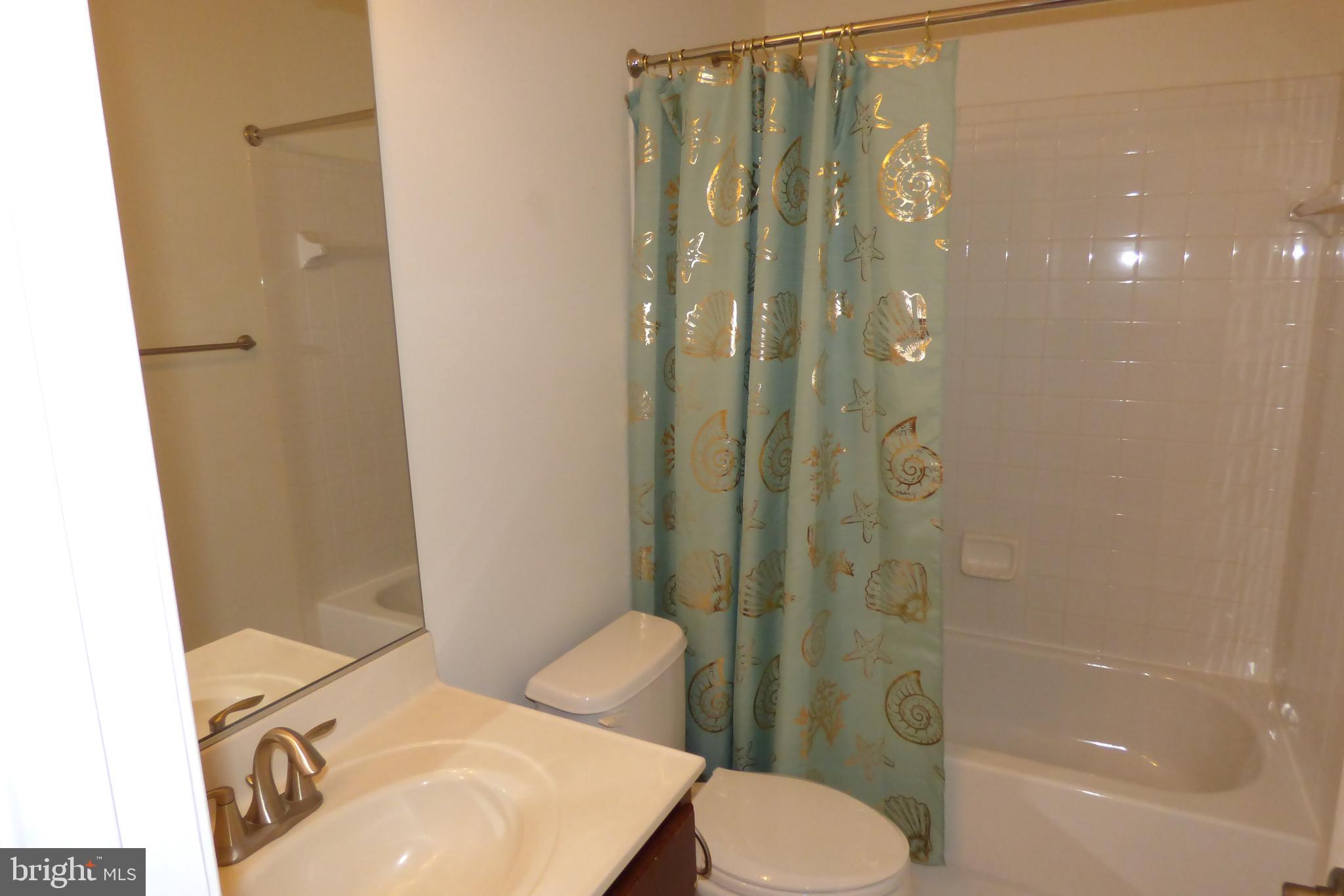 13113 Winding Trail Road Laurel, MD 20707 - Photo 9 of 47 a bathroom with a sink toilet and shower