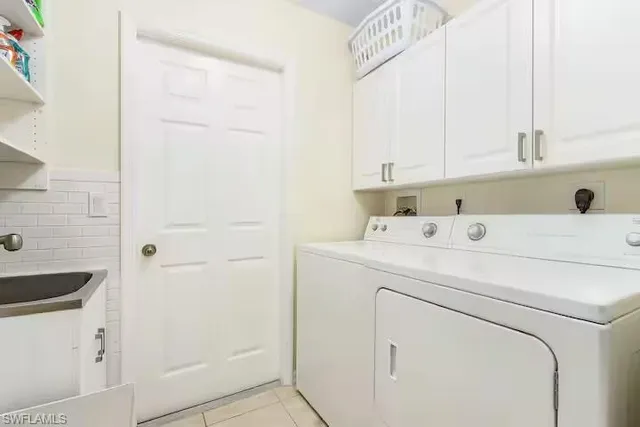 a bedroom with two beds and a window