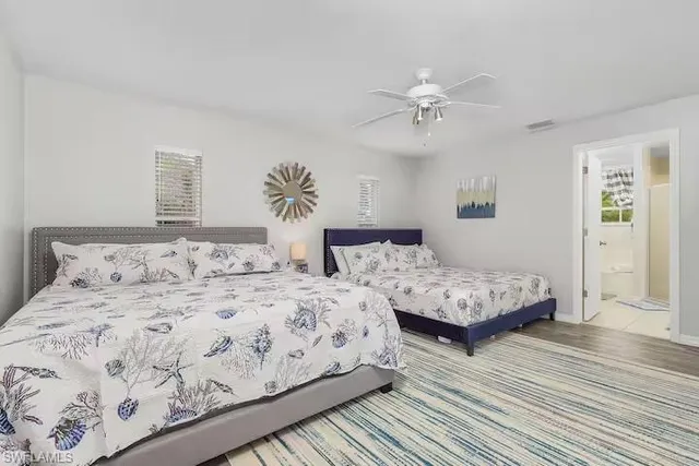 a bathroom with double sink and a mirror