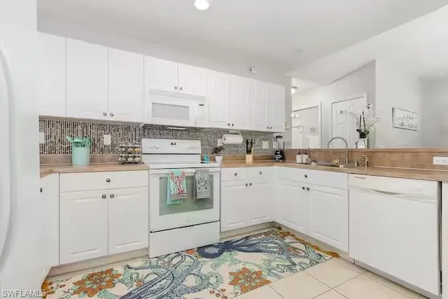 a view of a kitchen with a sink cabinets and a window