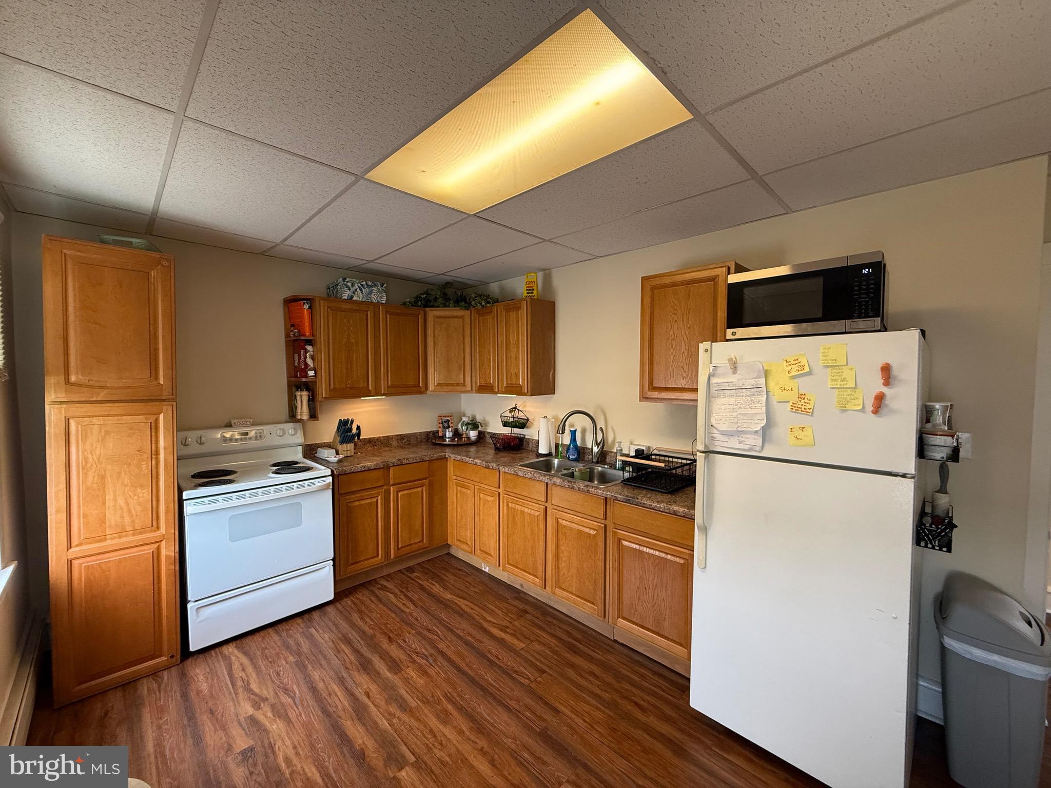 2441 Perkiomen Avenue Reading, PA 19606 - Photo 4 of 13 a kitchen with a refrigerator and a stove top oven