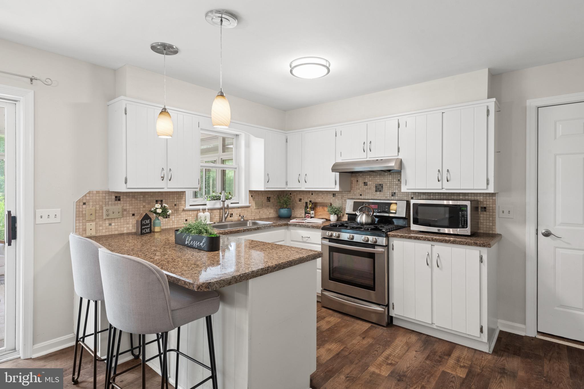 27 Buttonwood Drive Lititz, PA 17543 - Photo 11 of 50 a kitchen with white cabinets stainless steel appliances and sink