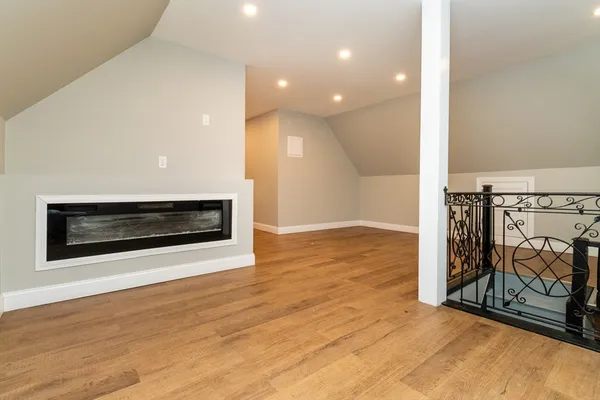 a view of a livingroom with wooden floor