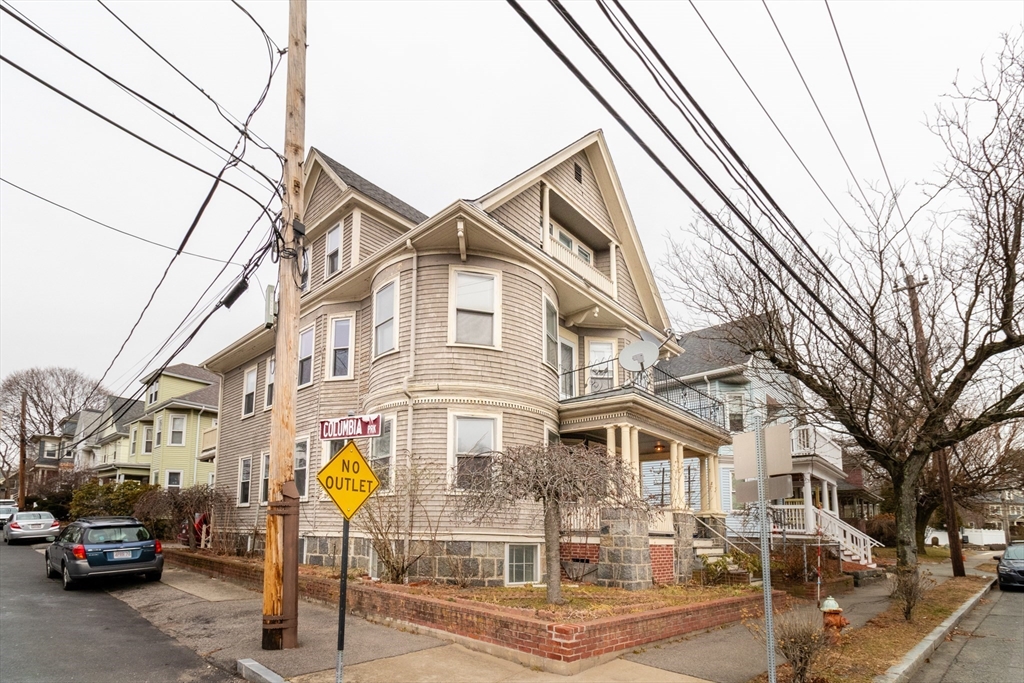 168 Brook Road Milton, MA 02186 - Photo 2 of 25 a front view of a building with parking