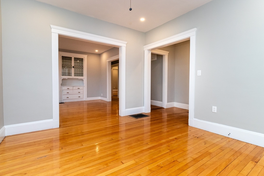 168 Brook Road Milton, MA 02186 - Photo 7 of 25 a view of empty room with wooden floor