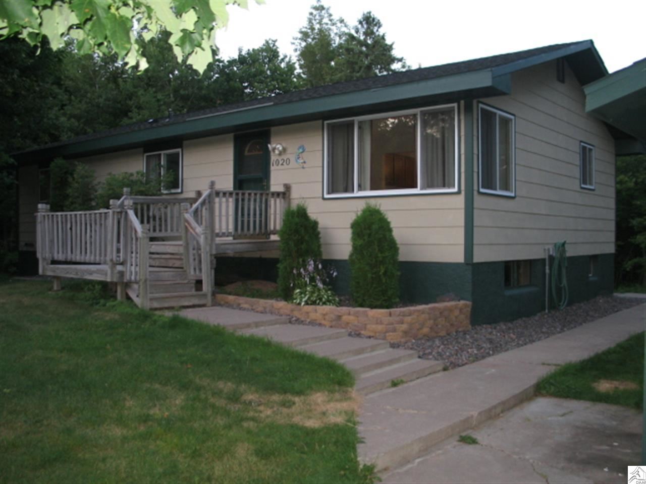 1020 Almac Drive Proctor, MN 55810 - Photo 2 of 17 Newer roofs, paint, and back porch!