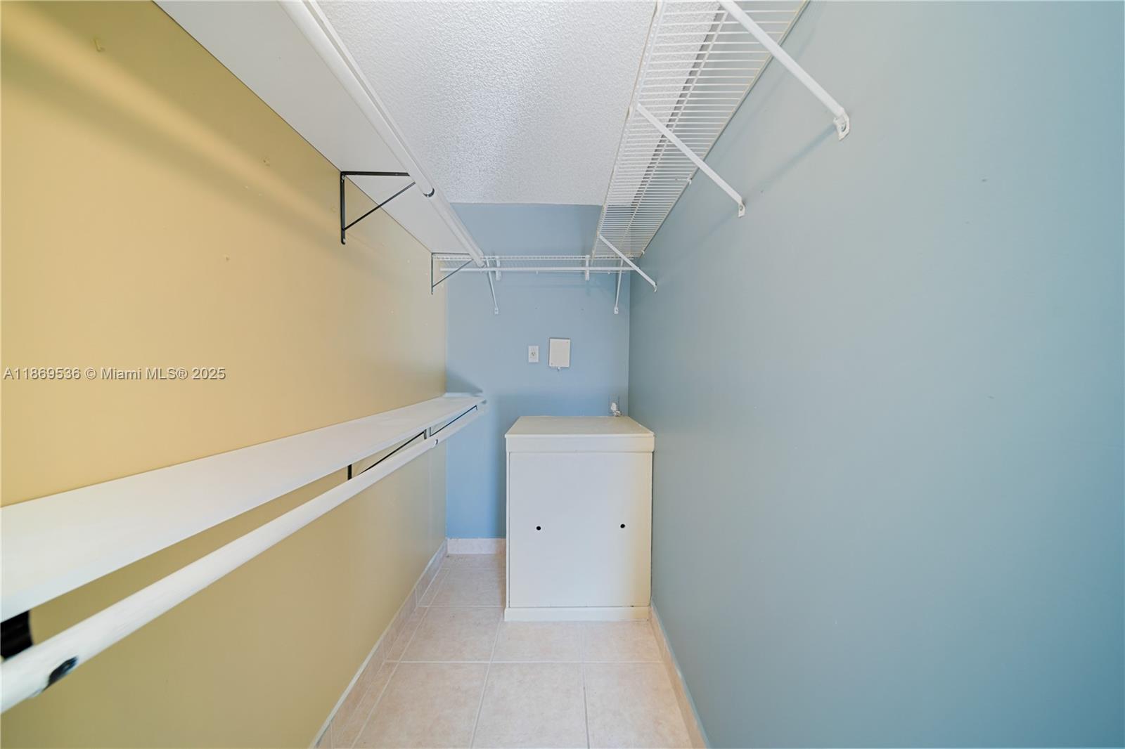 13455 Southwest 3rd Street, Unit 302S Pembroke Pines, FL 33027 - Photo 11 of 24 a view of a room with racks on the wall