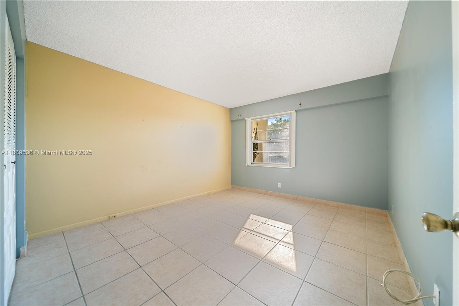 13455 Southwest 3rd Street, Unit 302S Pembroke Pines, FL 33027 - Photo 13 of 24 an empty room with windows