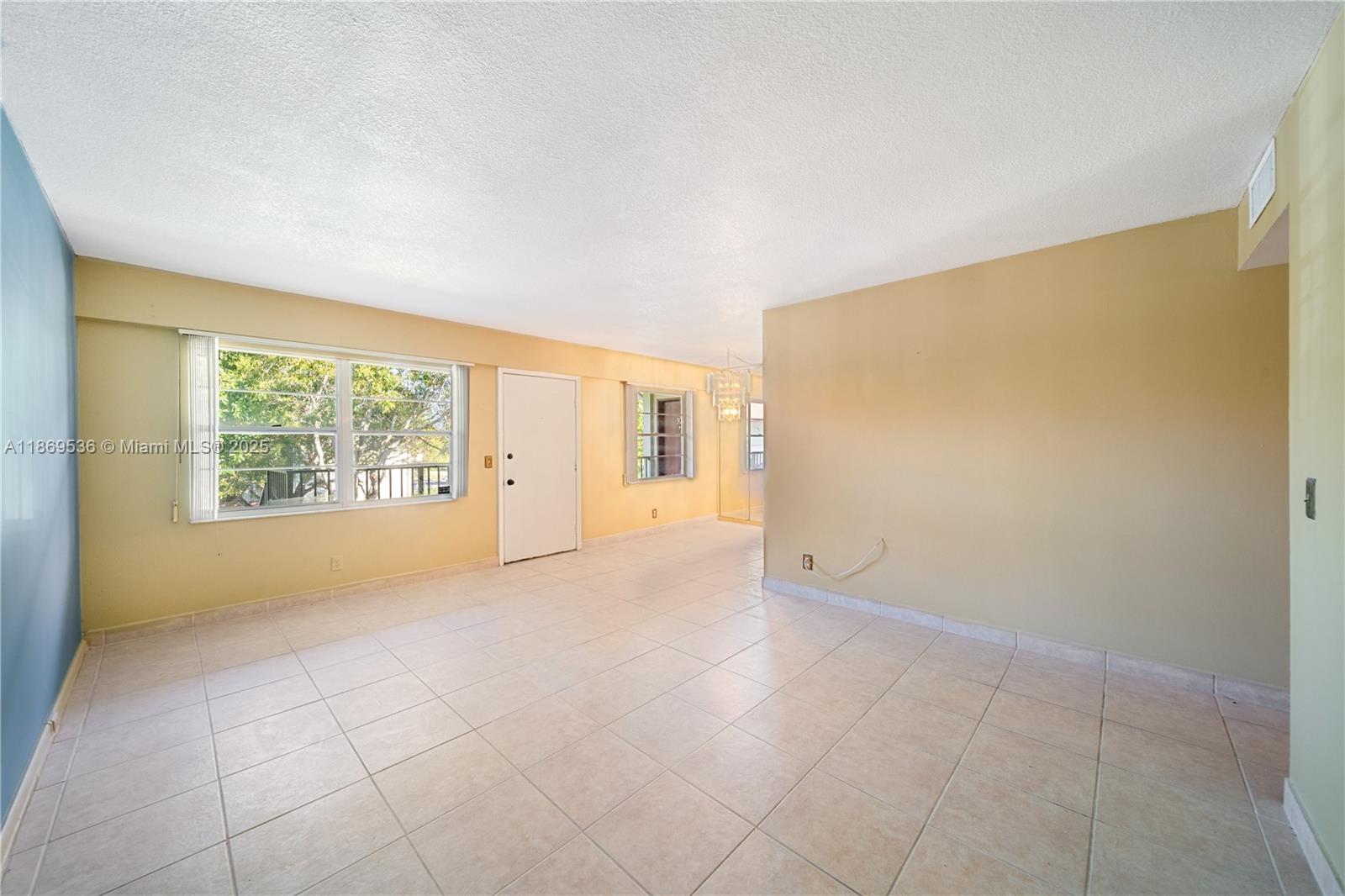 13455 Southwest 3rd Street, Unit 302S Pembroke Pines, FL 33027 - Photo 16 of 24 an empty room with windows