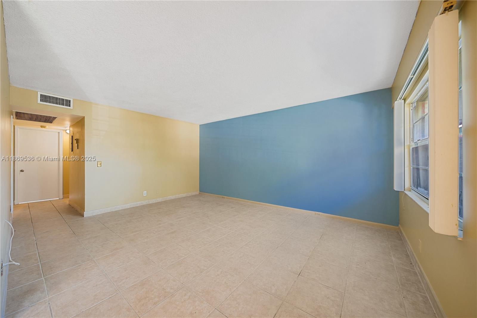 13455 Southwest 3rd Street, Unit 302S Pembroke Pines, FL 33027 - Photo 17 of 24 a view of an empty room and a window