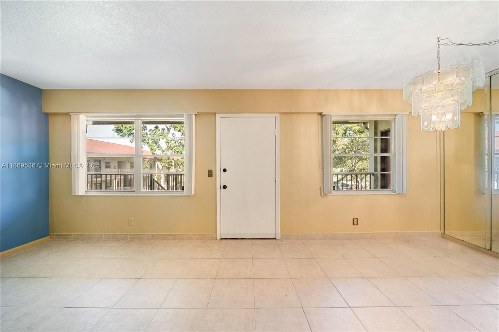 13455 Southwest 3rd Street, Unit 302S Pembroke Pines, FL 33027 - Photo 5 of 24 a view of an empty room with a window