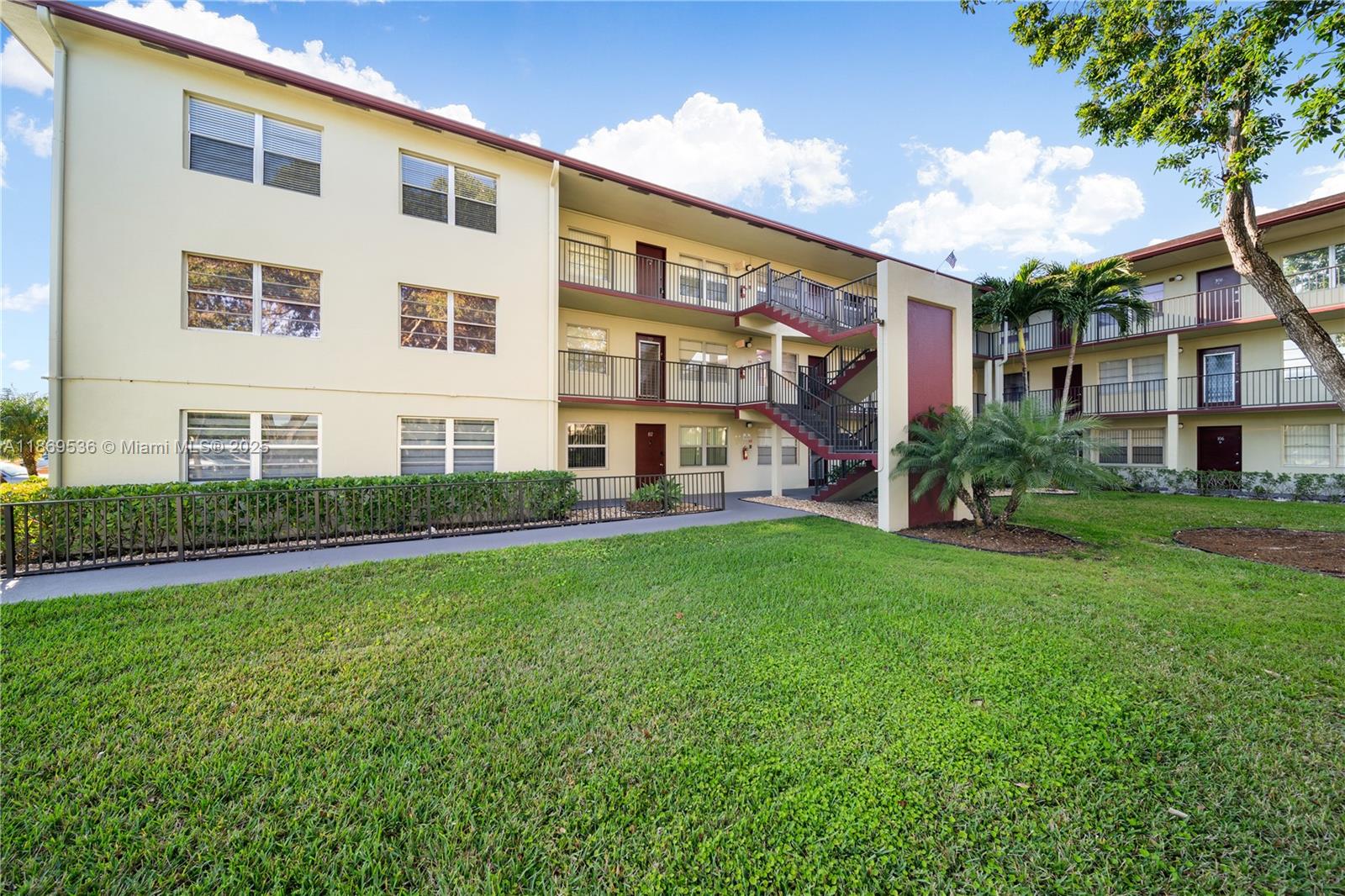 13455 Southwest 3rd Street, Unit 302S Pembroke Pines, FL 33027 - Photo 6 of 24 a view of a house with backyard and garden