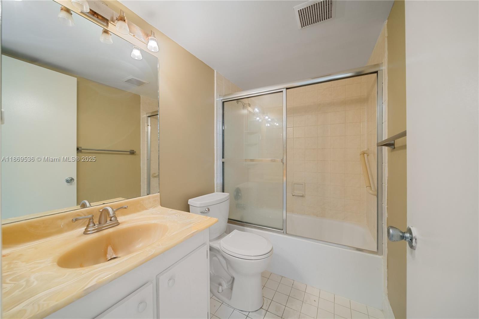 13455 Southwest 3rd Street, Unit 302S Pembroke Pines, FL 33027 - Photo 8 of 24 a bathroom with a granite countertop sink toilet and shower