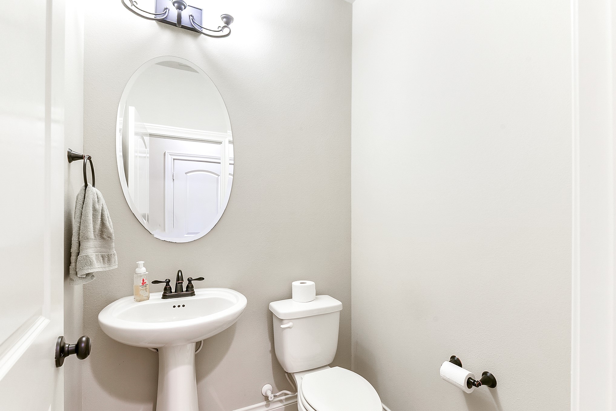 29023 Powder Ridge Drive Katy, TX 77494 - Photo 38 of 50 Downstairs, a convenient half bath is located near the hallway and between the kitchen and dining room, offering easy access for guests.