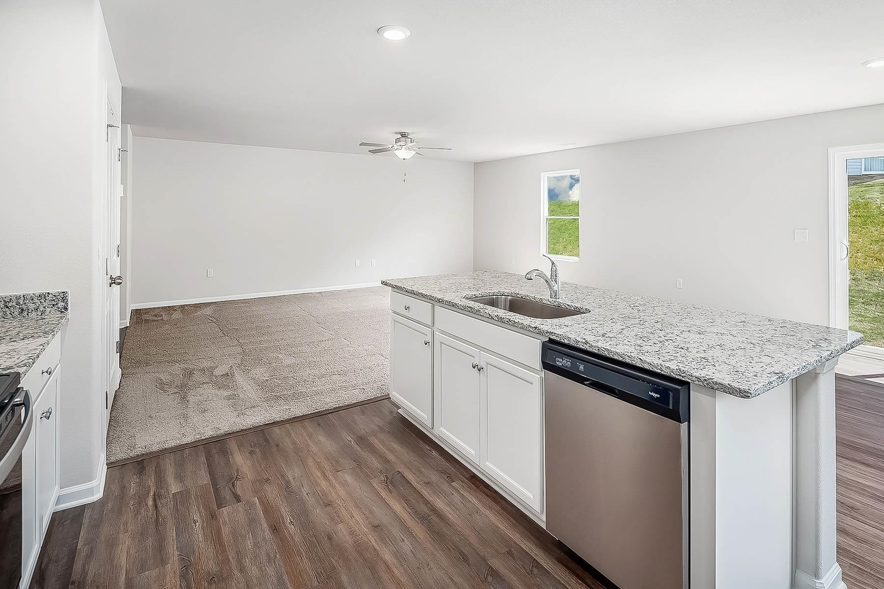 358 Coleshill Road Angier, NC 27501 - Photo 7 of 14 a kitchen with a sink and cabinets