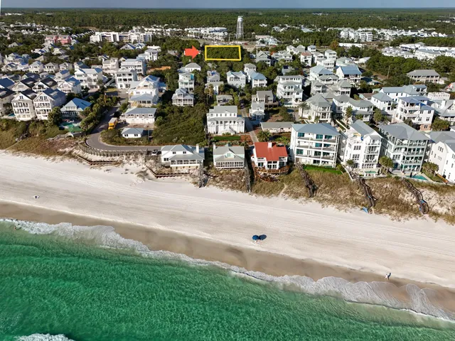 an aerial view of residential houses with city view