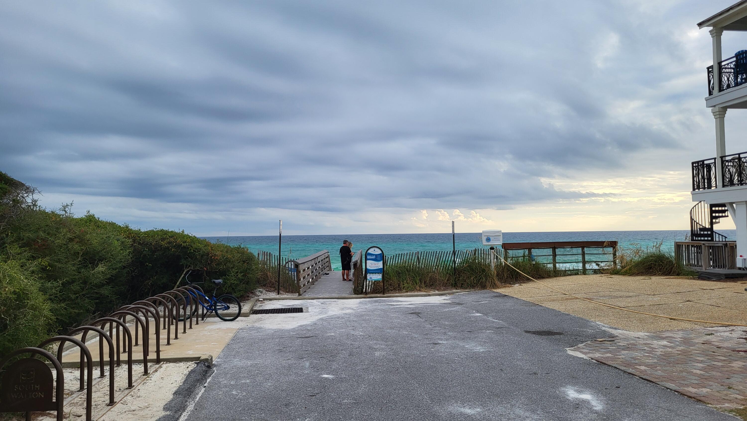 0 Walton Rose Ln Inlet Beach Inlet Beach, FL 32461 - Photo 42 of 49 a view of a street with a bench in front of it