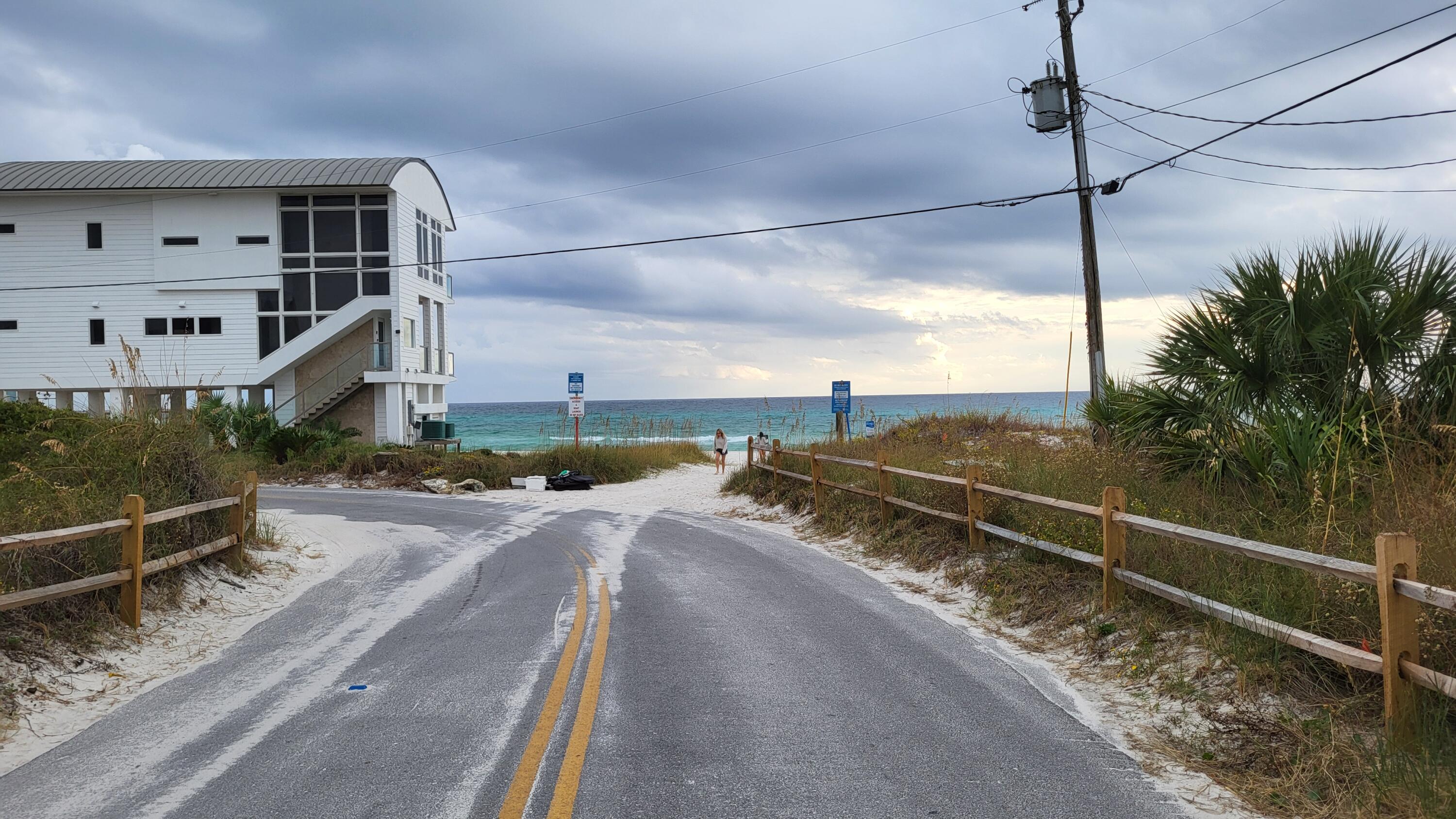 0 Walton Rose Ln Inlet Beach Inlet Beach, FL 32461 - Photo 47 of 49 a view of a balcony with floor to ceiling windows and wooden fence